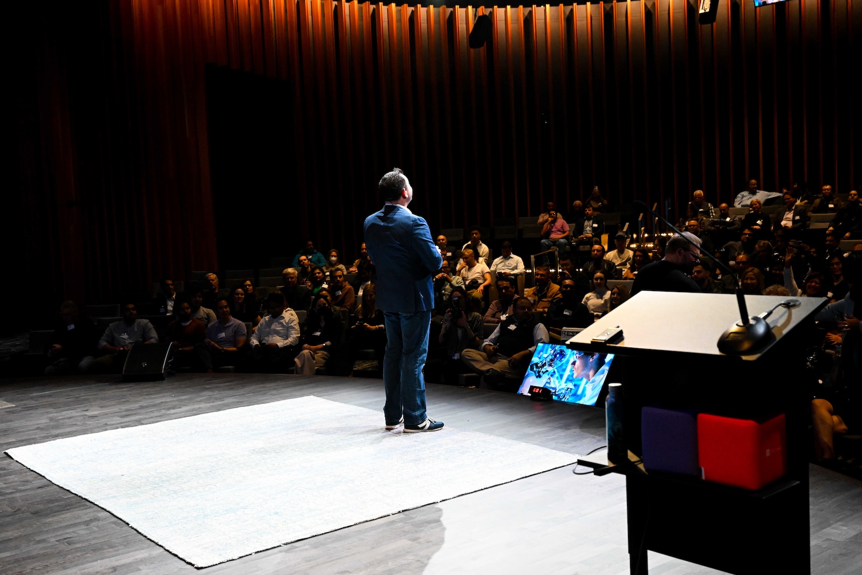 Robert Strong presenting on stage at Microsoft HQ event